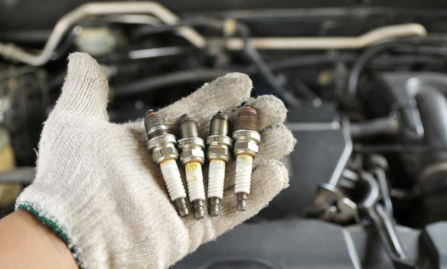 How do I know if my car needs a spark plug change?
