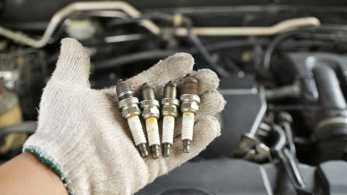 How do I know if my car needs a spark plug change?