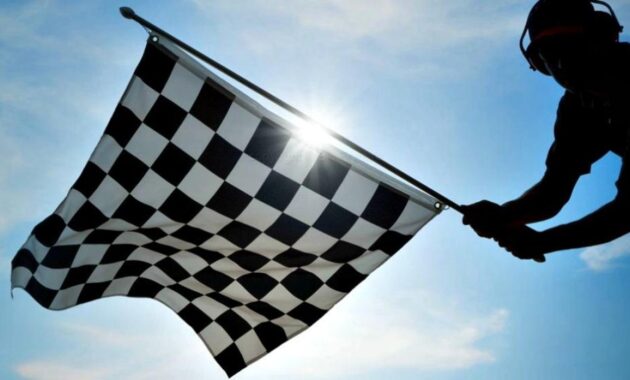 What is the checkered flag and how has it become a symbol of motorsport?