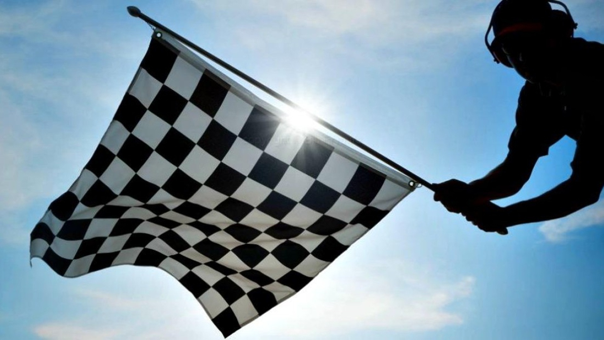 What is the checkered flag and how has it become a symbol of motorsport?