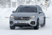 Volkswagen Touareg prototype hides its new style with stickers in new spy images